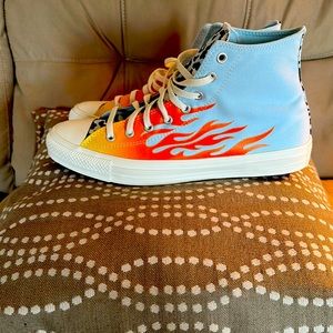 A custom made pair of converse Chuck Taylor shoes. Brand new never worn.